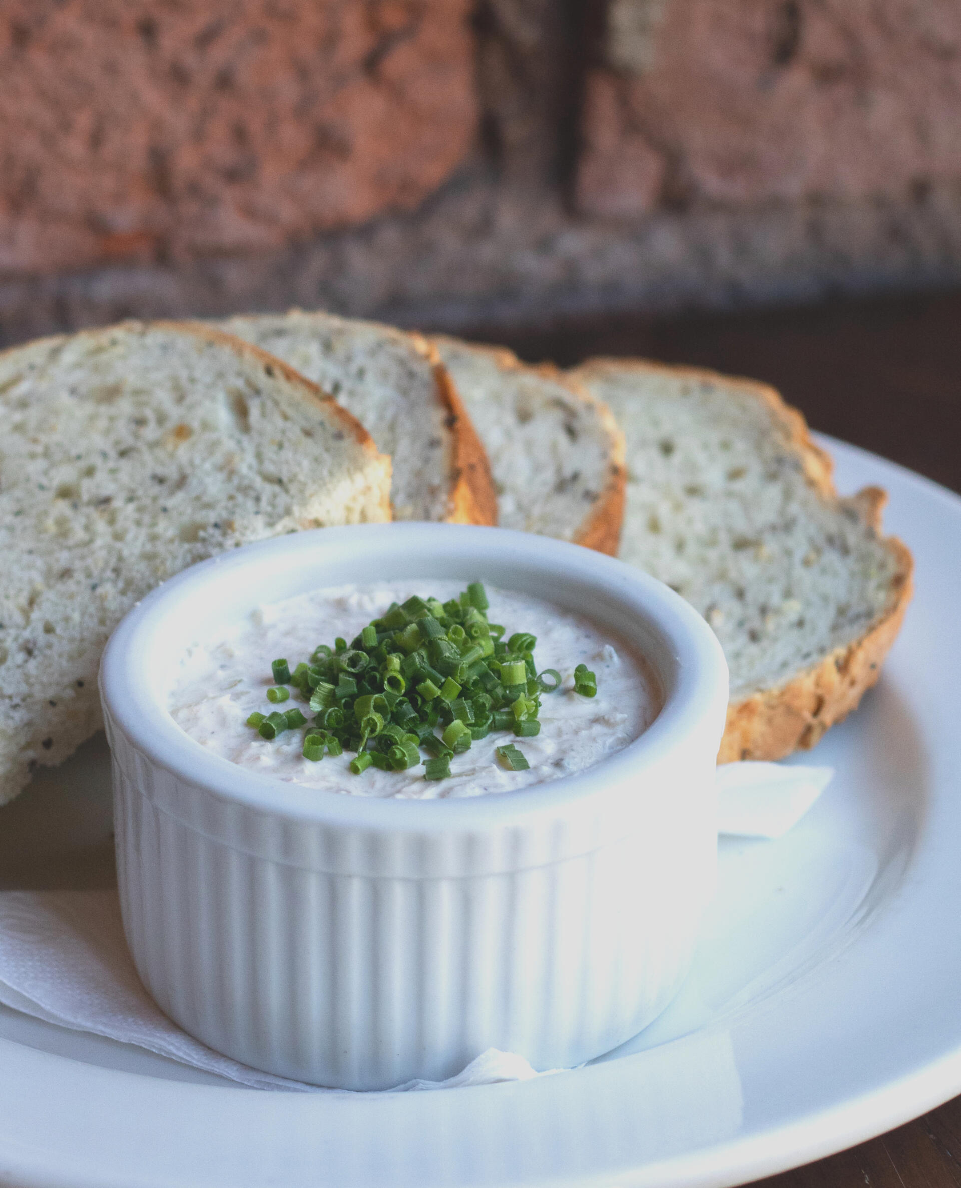 Creamy smoked fish dip served with house made bread at Swans Pub in Victoria, BC during Happy Hour 3-6pm - a flavorful appetizer to enjoy with friends.