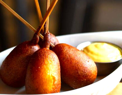 Stu's corn dogs served hot and crispy at Swans Pub in Victoria, BC during happy hour 3-6pm - a crowd-pleasing pub snack perfect for sharing.